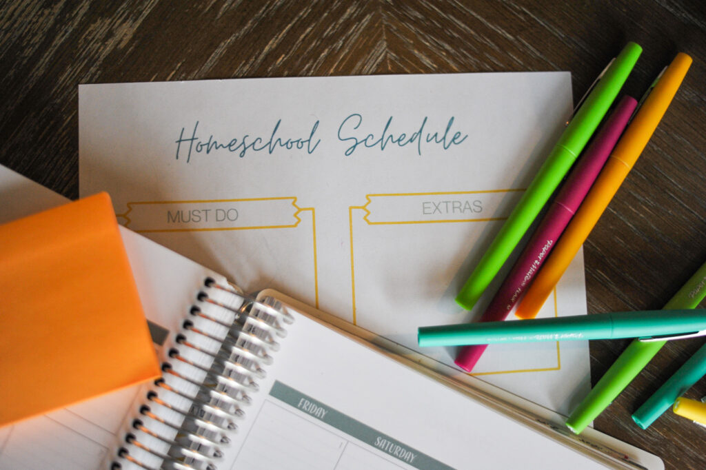 homeschool schedule planner on table with planner