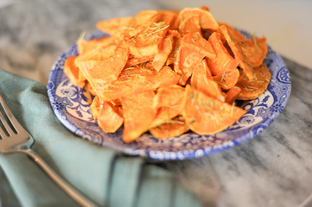 rosemary roasted sweet potatoes on a blue plate 